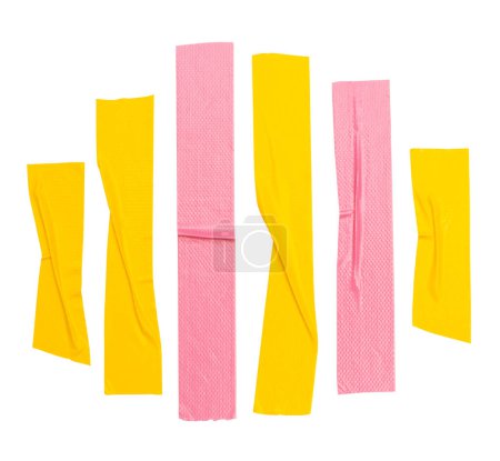 Top view set of  wrinkled yellow and pink adhesive vinyl tape or cloth tape in stripes shape is isolated on white background with clipping path.
