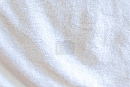 Wrinkled white towel texture with wave pattern is used as clothing texture in decorative art work.