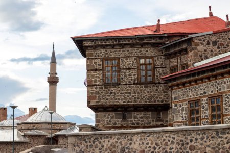 Tarihi Erzurum Tas Evleri or Traditional Erzurum stone houses on cobblestone street.