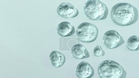 Drops of gel face serum top view. Abstract gel drops for design. Liquid gel moisturizer.