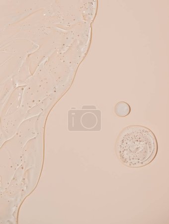 Photo for Abstract face serum texture. Skin care liquid gel on beige background. Transparent cosmetic face cream with bubbles for design. - Royalty Free Image