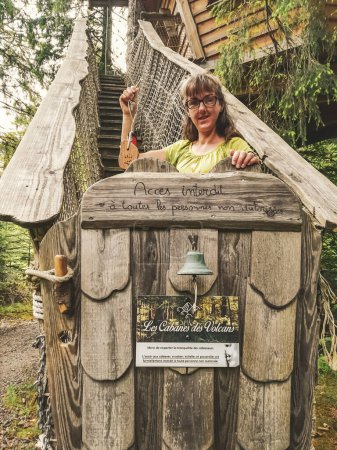 Photo for Portrait of a woman at the entrance to a Cabane des Volcans. - Royalty Free Image