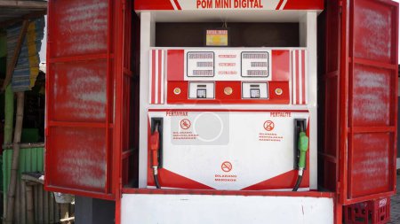 Foto de Surabaya, East Java, Indonesia -January, 2023 : Mini fuel gasoline station of premium, pertalite, pertamax Infront of the house usually called Pertamini or PERTAMINA mini - Imagen libre de derechos