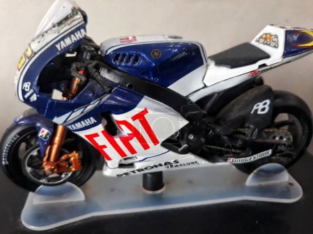 Photo for Selective focus replica miniature fiat Yamaha motorsport, MotoGP above computer hardware CPU in the work place : Surabaya, East Java, Indonesia - February, 2023 - Royalty Free Image