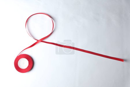 Photo for Red Support Ribbon isolated on white background. World aids day and national HIV/AIDS and aging awareness month with red ribbon. copyspace area - Royalty Free Image