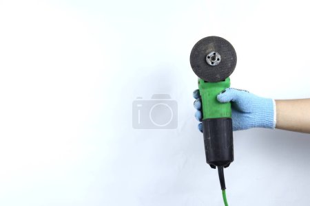 Gloved hand holding  angle grinder machine isolated on white background