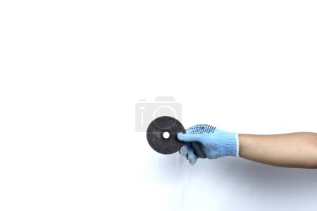 Photo for Gloved hand holding Angle grinder disc isolated on white background - Royalty Free Image