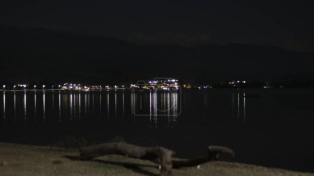 Photo for Lake at night with view of city lights - Royalty Free Image