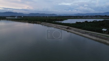 Photo for Aerial view of the road by the lake and mountains - Royalty Free Image