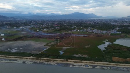 Photo for Aerial view of land fire on the edge of Lake Limboto - Royalty Free Image