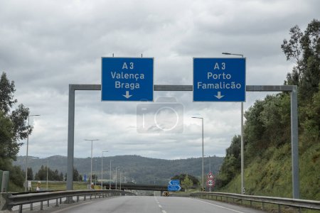 Section of the A3 motorway, Douro Minho, which connects Porto to Valenca, Portugal. Information board, directions. Quite cloudy day.