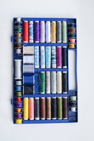 Photo for Rolls of thread, spools of thread in different colors for sewing work. - Royalty Free Image