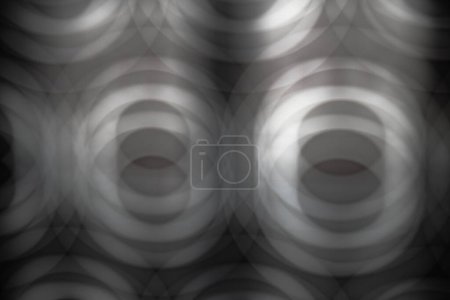 Abstraktes Bild in Grautönen mit mehreren verschwommenen Kreisen, das das Gefühl von Tiefe erzeugt. Tapeten, Muster, Hintergründe.