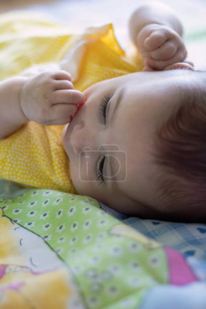 Photo for Loving baby relaxed lying on top of a blanket. Close up - Royalty Free Image