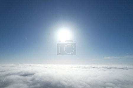 Photo for Drone view above the foggy clouds at daytime - Royalty Free Image