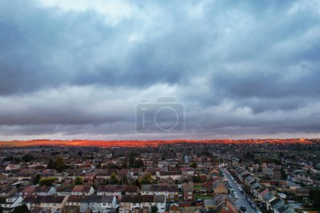 Photo for Beautiful Orange Sunset and Clouds over City - Royalty Free Image