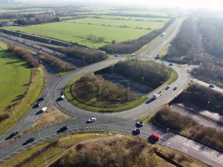 Photo for Aerial View of British Highway Roads with Traffic on a Bright Sunny Day. The High Angle View was Captured at over Kempston Village of Bedford City of England - Royalty Free Image
