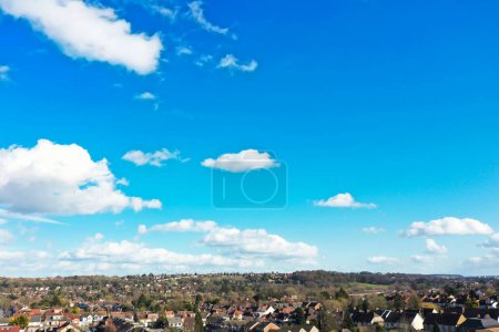 Photo for Beautiful Blue Sky with Few Clouds on a Clear Sunny Day over City - Royalty Free Image
