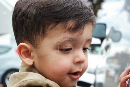 Photo for Cute little boy walking street - Royalty Free Image