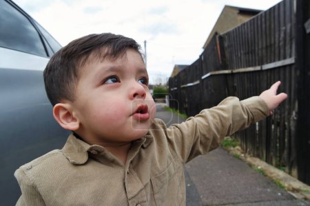 Photo for Cute little boy walking street - Royalty Free Image