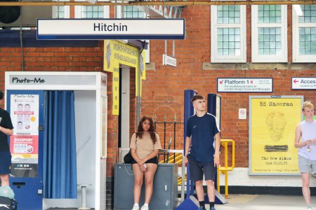 Photo for Hitchen, England, United Kingdom - June 18, 2023: People are Waiting for Train on Platform of Hitchen Railway Station - Royalty Free Image