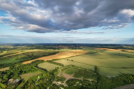 Photo for High Angle View of British Countryside Landscape During Just Before Sunset. The Footage Was Captured at Sharpenhoe Clappers Luton, Bedfordshire England UK on June 24th, 2023 with Drone's Camera. - Royalty Free Image