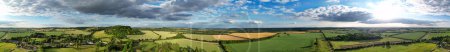 Panoramic High Angle View of British Countryside Landscape During the Beautiful Sunset. The Footage Was Captured at Sharpenhoe Clappers Luton, Bedfordshire England UK on June 24th, 2023
