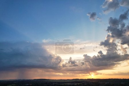 Photo for High Angle View of Luton City of England During Sunrise with Dramatical Clouds over Blue Sky. Image Was Captured with Drone's Camera on July 8th, 2023 - Royalty Free Image