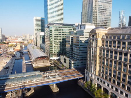 Photo for High Angle View of Canary Wharf Buildings from River Thames at Central London City of England Great Britain. The Footage Was Captured with Drone's Camera at Low Altitude on June 8th, 2023 - Royalty Free Image