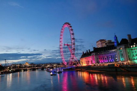 Photo for Beautiful Footage of Illuminated River Thames at London eye from Westminster, Big Ben clock Tower at After Sunset Night. England Great Britain,  Footage Was Captured on Aug 02nd, 2023 - Royalty Free Image