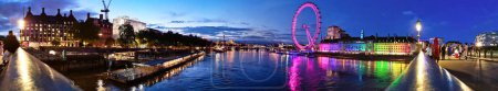 Photo for Most Beautiful Footage of Illuminated London eye from River Thames Westminster, Big Ben clock Tower at After Sunset Night. England Great Britain,  Footage Was Captured on Aug 02nd, 2023 During Sunset. - Royalty Free Image