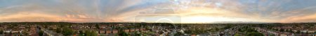 Photo for Panoramic view of dramatical clouds during sunset over city - Royalty Free Image