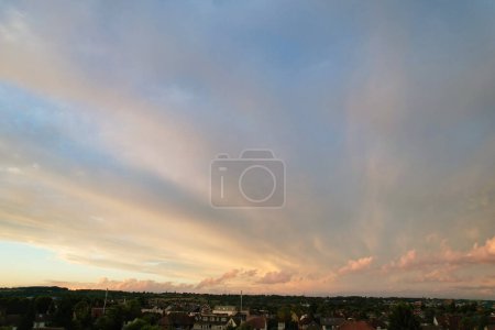 Photo for Dramatical clouds during sunset over city - Royalty Free Image