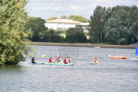 Photo for High Angle footage of People are Boating at Caldecotte Lake Located at Milton Keynes City of England Great Britain UK. The Aerial Landscape Was Captured on August 21st, 2023 with Drone's Camera - Royalty Free Image
