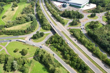 Photo for High Angle view of British Road and Traffic at Milton Keynes City of England UK. Aerial Footage Was captured on August 21st, 2023 with Drone's camera - Royalty Free Image