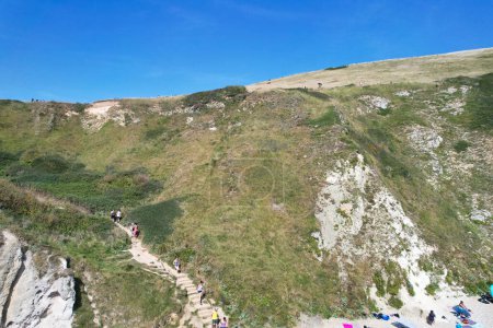 Photo for People at Durdle Door Hills of England Great Britain, UK. Image Was captured with Drone's camera on September 9th, 2023 - Royalty Free Image