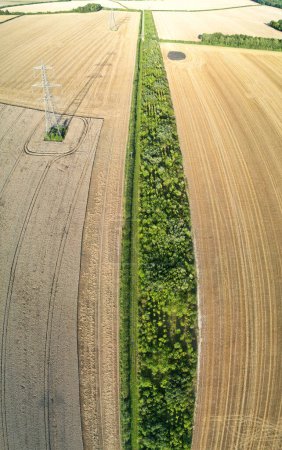 Photo for High Angle View of British Agricultural Farms at Countryside Landscape of England, Great Britain of UK. Image Was Captured with Drone's Camera on August 19th, 2023 - Royalty Free Image