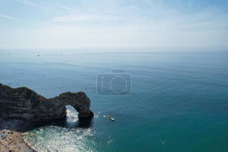 Photo for Crowd at Durdle Door Beach of England Great Britain, UK. Image Was captured with Drone's camera on September 9th, 2023 - Royalty Free Image