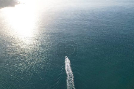 Photo for Gorgeous High Angle View of People are Enjoying the Hot British Weather on Boats and Swimming in Ocean Beach of Durdle Door Sea View Waters of England Great Britain. Image Captured on Sep 9th 2023 - Royalty Free Image