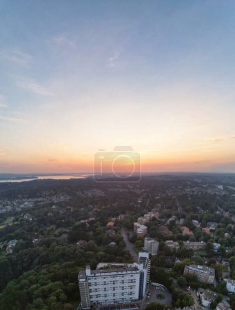 Photo for Aerial Vertical Panoramic View of British Tourist Attraction of Bournemouth Beach and Sea view City of England Great Britain UK. High Angle Image Captured with Drone's Camera on September 9th, 2023 During Hot Weather and Sunset. - Royalty Free Image