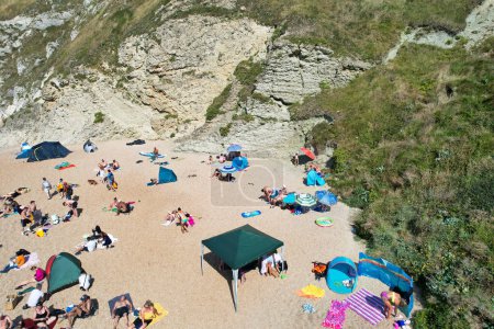 Photo for Crowd at Durdle Door Beach of England Great Britain, UK. Captured with Drone's camera on September 9th, 2023 - Royalty Free Image