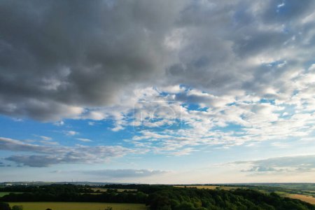 Photo for Most Beautiful and Best High Angle View of Dramatic and Thick Clouds and Blue Sky over British Countryside at Sharpenhoe Clappers Near Luton City of England UK. June 24th, 2023 During Sunset Time - Royalty Free Image