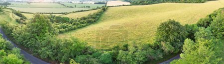 Photo for British Agricultural Farms of Sharpenhoe Clappers Countryside Landscape Nearby Luton City of England Great Britain of UK. Footage Was Captured with Drone's Camera on June 24th, 2023 - Royalty Free Image