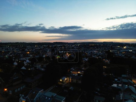 Photo for High Angle View of Illuminated Luton City of England During Most Beautiful Colourful Sky and Orange Clouds over England UK. Image Captured with Drone's Camera on October 6th, 2023 - Royalty Free Image