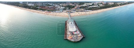 Photo for Aerial Vertical Panoramic View of British Tourist Attraction of Bournemouth Beach and Sea view City of England Great Britain UK. High Angle Image Captured with Drone's Camera on August 23rd, 2023 - Royalty Free Image