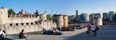 Photo for Panoramic View of People are Enjoying Warm Day of 4-June-2023 at the Edge of River Thames of Central London England UK. Most of the Families and young couples are Walking Around and Enjoying their Time - Royalty Free Image