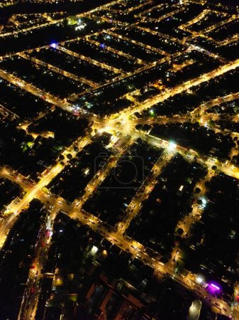Photo for High Angle of Luton City of England During Night. Illuminated City Centre Was Captured with Drone's Camera on October 22nd 2023 During Night - Royalty Free Image