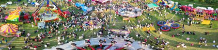 Photo for High Angle Panoramic View of a Funfair with Rides for Local Public of Luton City of England UK. The Funfair Was Held During Holidays to Celebrate Eid Festival of Muslim Community. June 29th, 2023 - Royalty Free Image