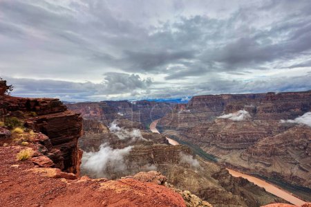 Up in the clouds at the West Rim of the Grand Canyon. Guano Point full of clouds on a cold wet foggy day at one of the seven wonders of the world.
