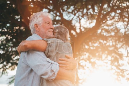 Photo for Head shot close up portrait happy grey haired middle aged woman snuggling to smiling older husband, enjoying tender moment at park. Bonding loving old family couple embracing, feeling happiness. - Royalty Free Image